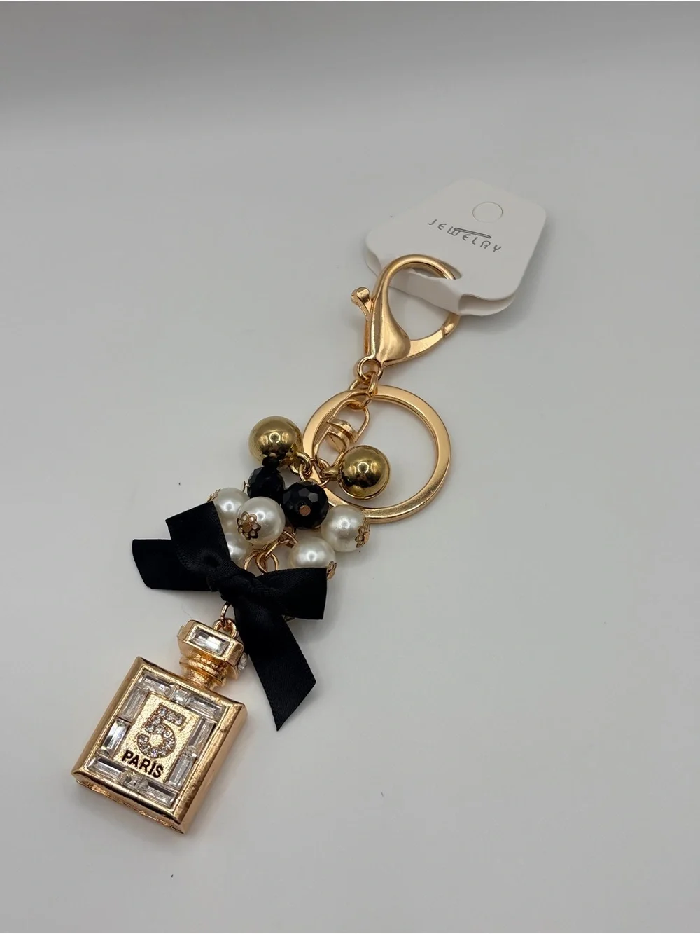 Gold Perfume Bottle Keychain with Black Bow and Pearls